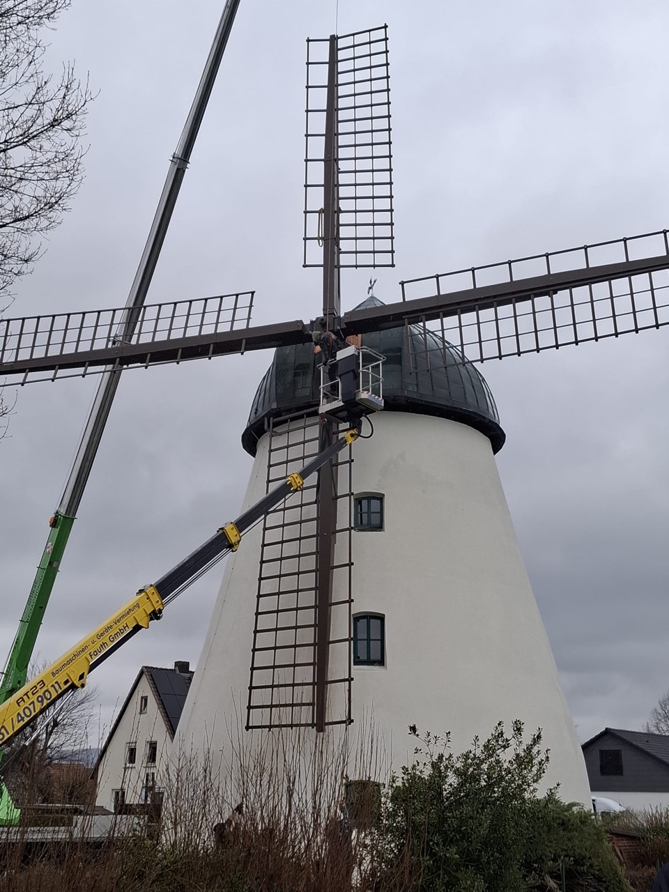 All four sails mounted, crane still alongside