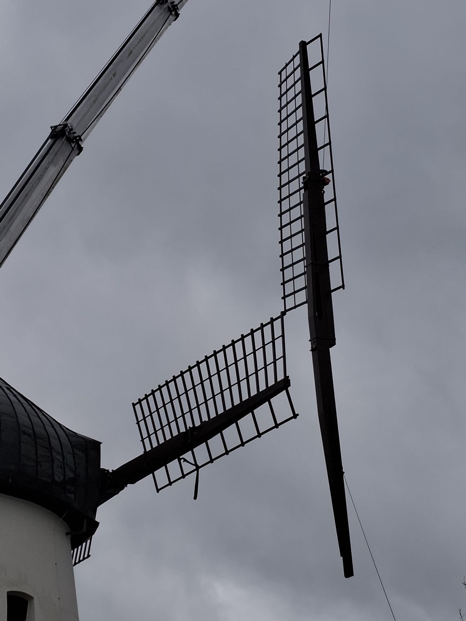 Two sails already mounted on the windmill